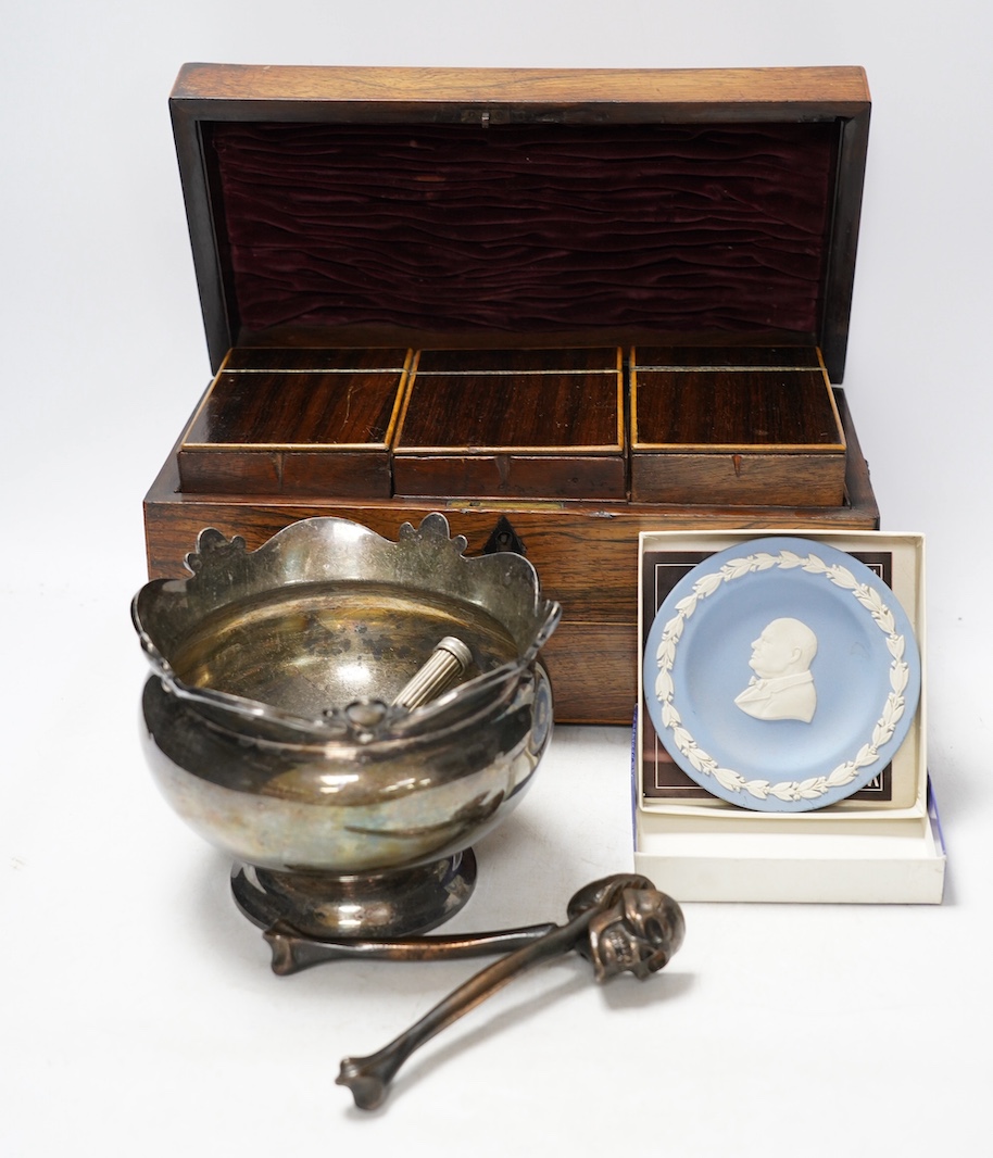 A Regency rosewood tea caddy, three pairs of nut crackers including a novelty skull nut cracker, a plated bowl, two napkin rings and a Wedgwood dish. Condition - varies